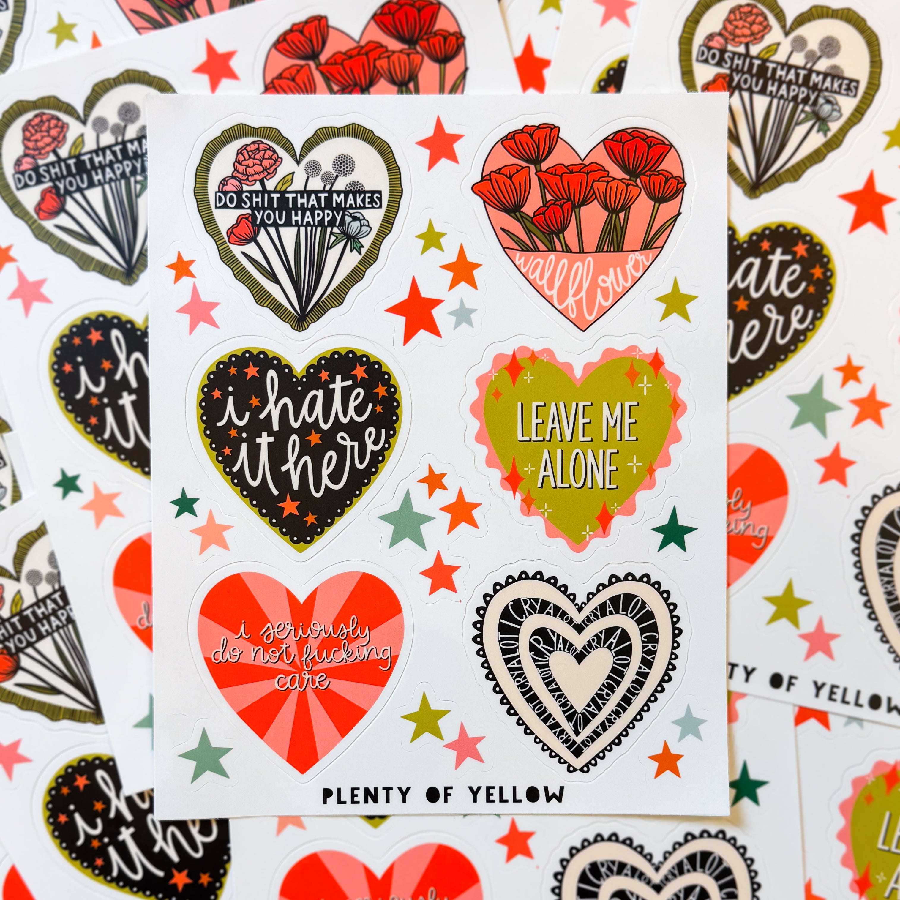 A sticker sheet of six big hearts containing different silly sentiments with smaller star stickers in between.