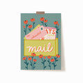 A 5x7 art print of a mailbox on a light blue background surrounded by red flowers. Inside the mailbox is a letter from 'me.' and addressed to 'exhausted'. There is also a magazine that says 'CATS: 12 WAYS TO NAP BETTER'.