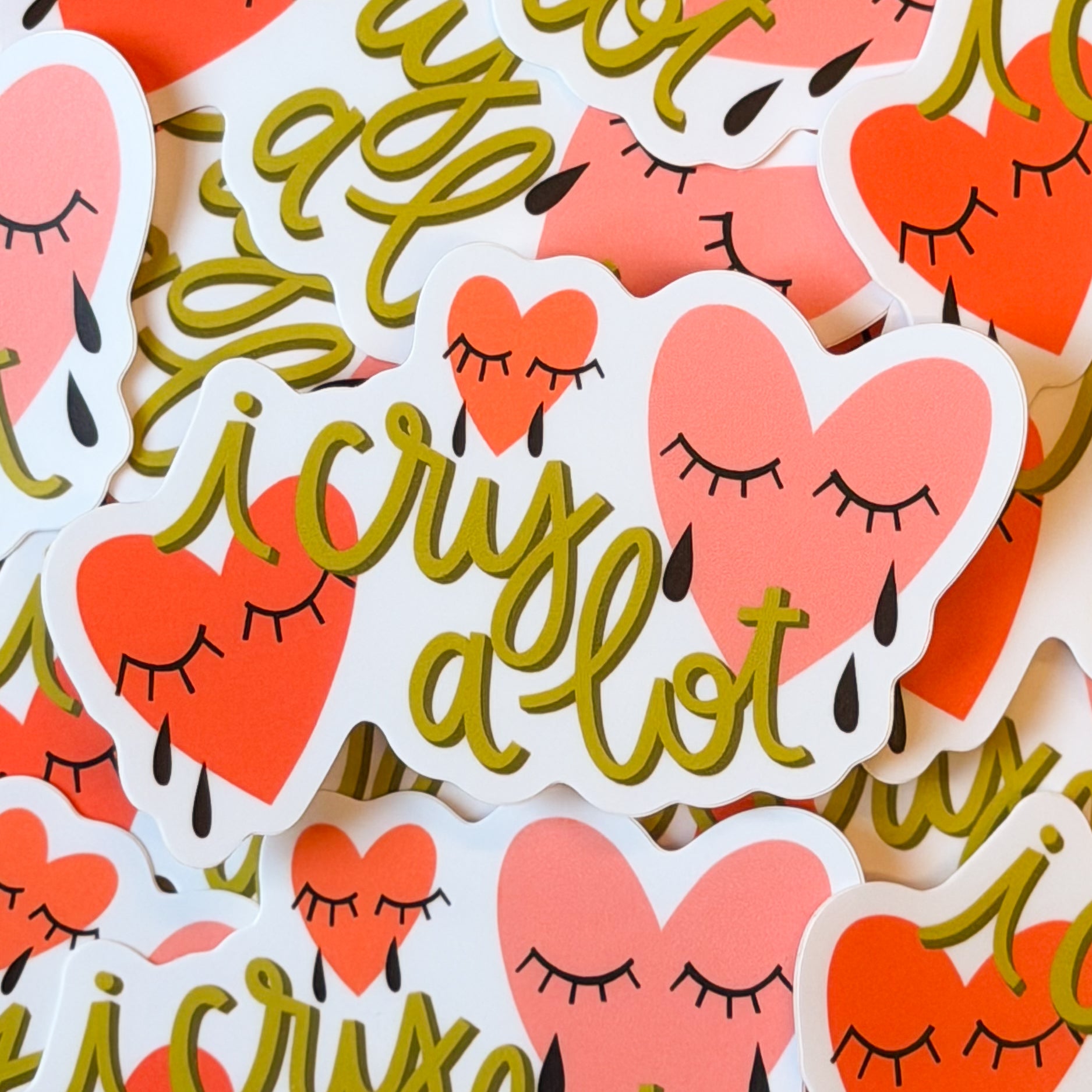 Stickers with hearts with eyes closed and text 'I cry a lot'.