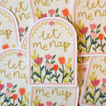 Floral stickers with 'let me nap' text on an off white background