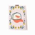 A5x7 art print with Orioles baseball hat on a pink grid background surrounded by yellow and teal flowers.