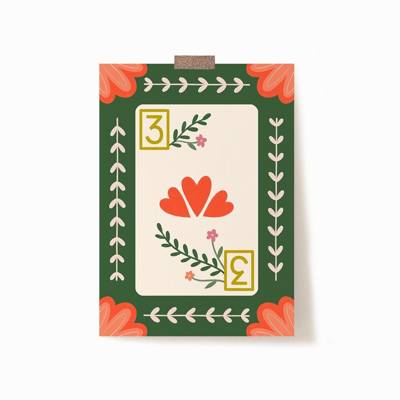 A 5x7 art print of a 3 of hearts playing card with florals and a green background and peach corner embellishments.