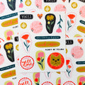 A pile of sticker sheets that consists of a bunch of small filler stickers.