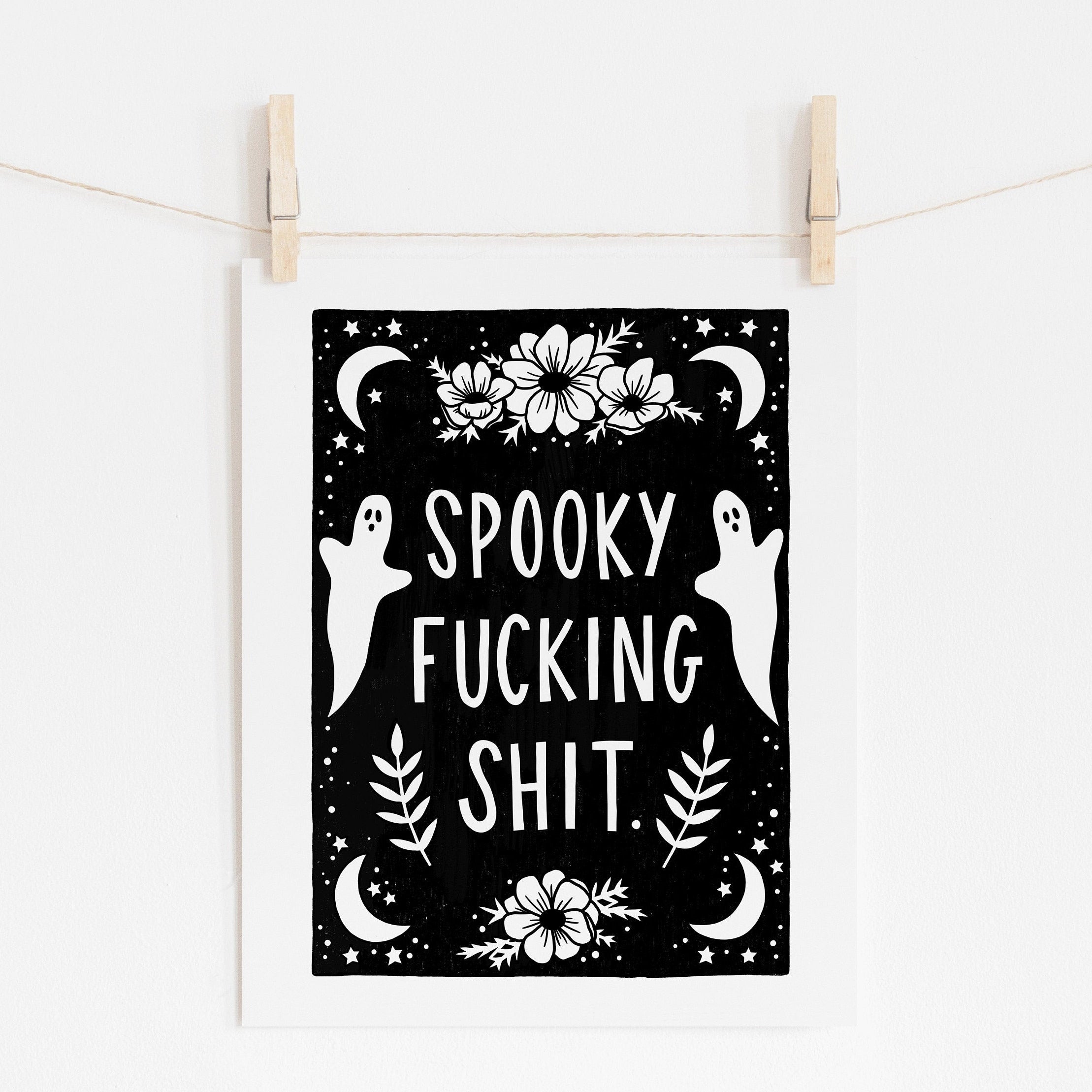 8x10 art print that says 'spooky fucking shit.' surrounded by flowers, ghosts, and  moons and stars in white on a black background.