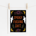 8x10 art print that says 'spooky fucking shit.' in orange, surrounded by purple flowers, white ghosts, and yellow moons and stars on a black background.