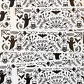 A pile of black and white bumper stickers that say 'spooky season forever' surrounded by ghosts, bats, cats, and other halloween whimsy.