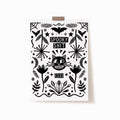 A 5x7 black and white art print that says 'SPOOKY SHIT' on the top with '1331' at the bottom, with a cat in the middle, surrounded by whimsy illustrations.