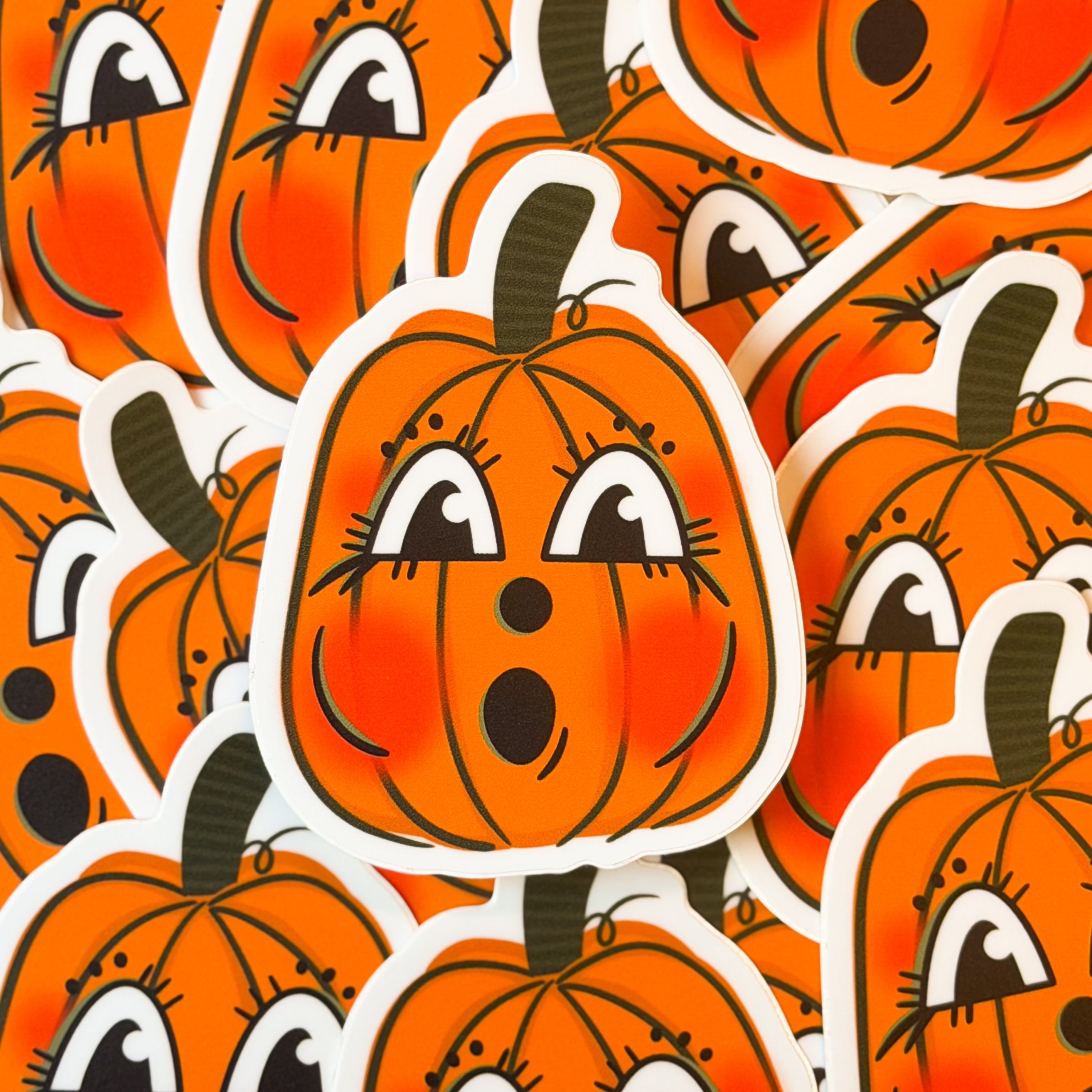 A vintage halloween pumpkin sticker with a cute face.Vintage halloween pumpkin sticker with cute face.