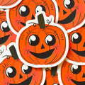 A vintage halloween pumpkin sticker with a cute face.