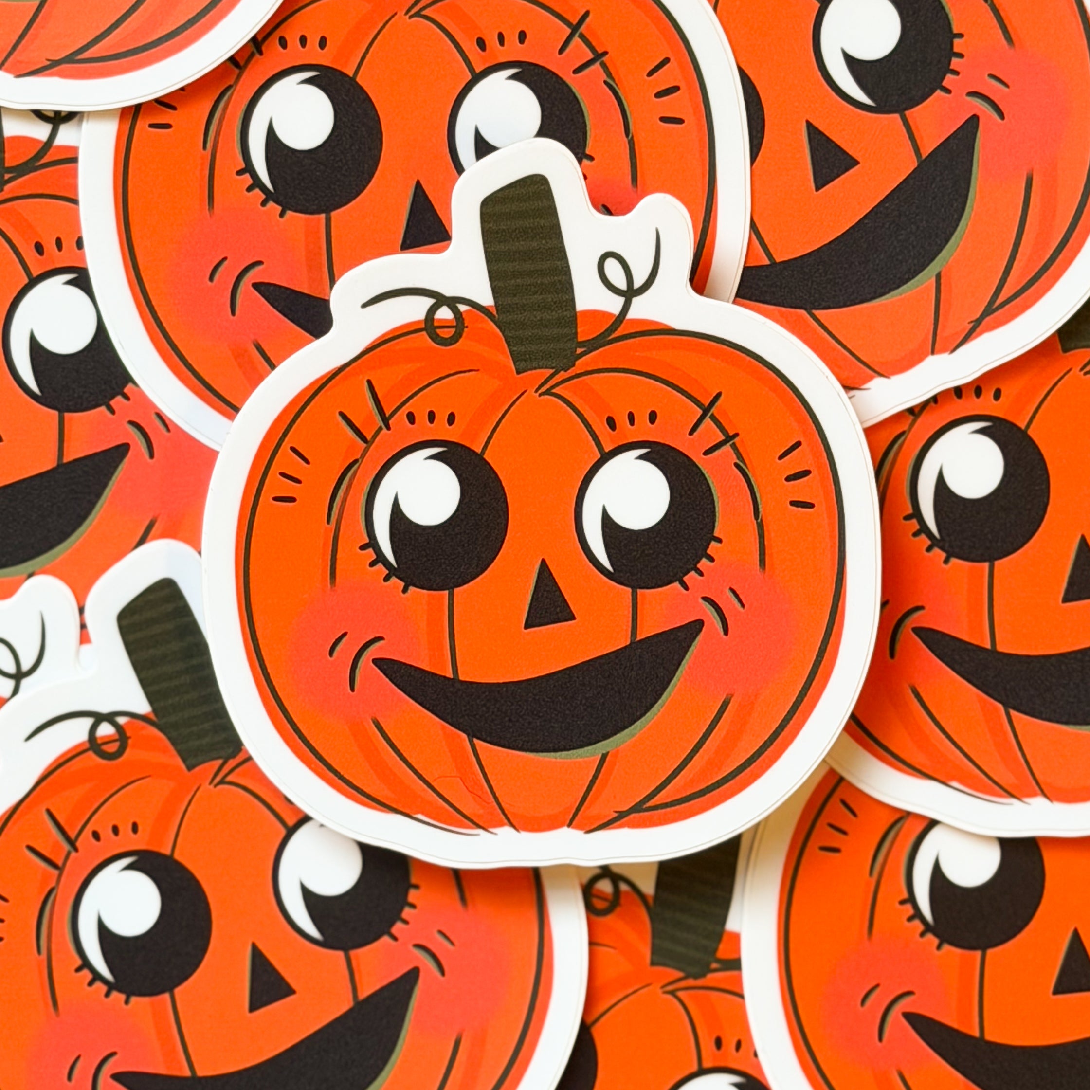 A vintage halloween pumpkin sticker with a cute face.