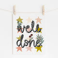 An 8x10 art print that says 'well done' in black and white with flowers and stars printed in the background.